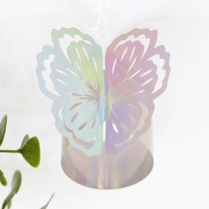 Detailed view of butterfly napkin ring featuring laser gradient hollow pattern with a base