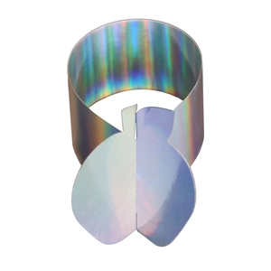 Detail of holographic apple napkin ring showing colorful laser finish and modern shape