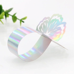 Detail of laser-cut iridescent butterfly napkin ring with holographic laser effect
