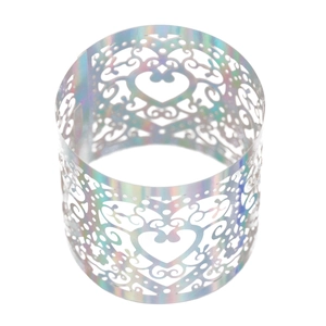 Macro shot of holographic heart napkin ring with laser-cut lace and iridescent finish