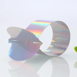 Close-up of laser holographic butterfly napkin ring showing iridescent colorful reflections
