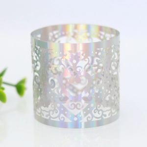 Close-up of laser-cut holographic heart napkin ring with intricate vine patterns