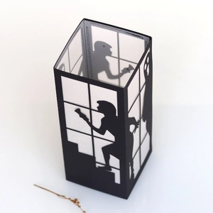 Detailed shadow box design featuring a silhouette of a woman running and a ghost figure