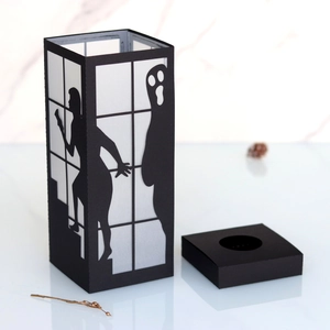 Halloween ghost paper silhouette lantern with haunting female figure and spooky ghost motifs
