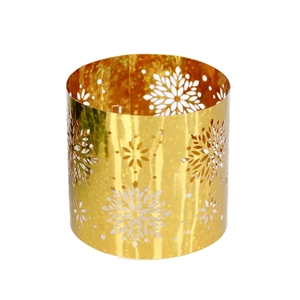 Close-up of golden cylindrical napkin ring featuring intricate snowflake cut-out patterns