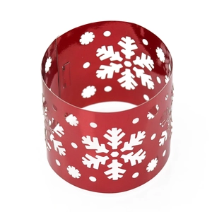 Macro shot of red snowflake hollow-out napkin ring with festive glossy finish