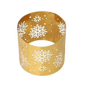 Close-up of golden hollow snowflake napkin ring with polished metal finish for party