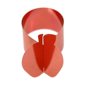 Close-up of a red apple napkin ring with a shiny metallic mirror finish for table decor