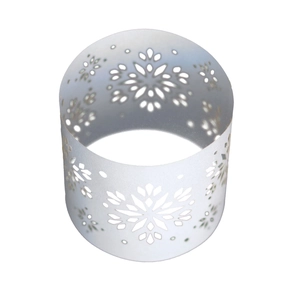 Macro shot of white snowflake laser-cut napkin ring with pearlescent hollow design