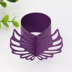 Detailed laser-cut purple wing napkin ring made of pearl paper for wedding table decor