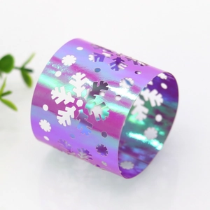 Detail of iridescent snowflake napkin ring with holographic finish for Christmas decor