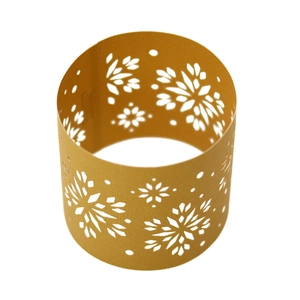 Macro view of golden laser-cut paper napkin rings with elegant snowflake hollow patterns