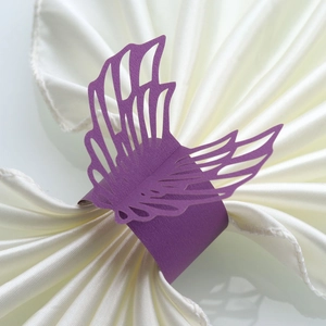 Elegant purple pearlescent paper napkin rings with laser-cut angel wings design