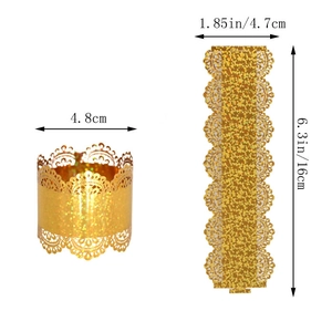 Close-up of gold laser-cut lace napkin ring with dimension details for party decor