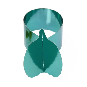 Macro view of mirror-finish teal pumpkin leaf napkin ring with shiny metallic surface