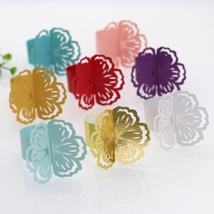 Detailed laser-cut floral paper napkin rings in diverse shimmering pearlescent colors