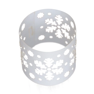Macro shot of white snowflake laser-cut napkin ring for Christmas holiday party decor