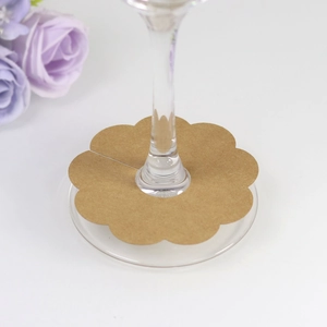 Close-up of flower-shaped kraft paper wine glass cards for wedding party decor