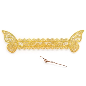 Detail of laser-cut gold glitter butterfly napkin ring with intricate lace patterns