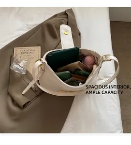 Detail of white leather tote bag interior showing large capacity for tablet and daily items