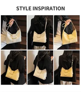 Model wearing cream and light yellow PU leather hobo bags with golden hardware details