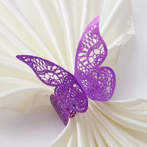 Sparkling purple laser-cut butterfly napkin ring with glitter finish for wedding table decor
