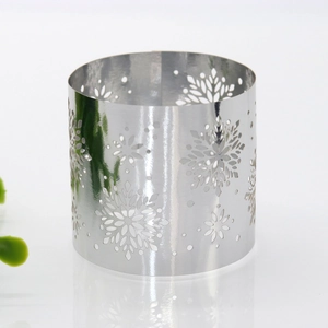 Macro view of polished silver metal napkin ring with precision snowflake cutouts