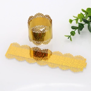 Detailed view of golden holographic lace napkin ring with laser-cut glitter patterns