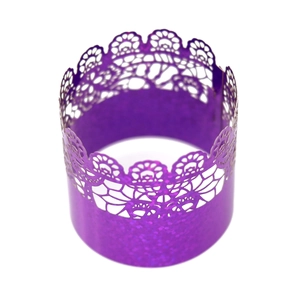 Macro detail of purple laser-cut lace napkin ring with sparkling glitter finish for parties