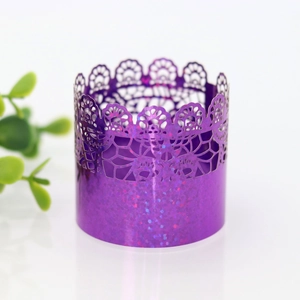 Detail of purple glitter lace paper napkin ring with laser-cut floral edge for weddings