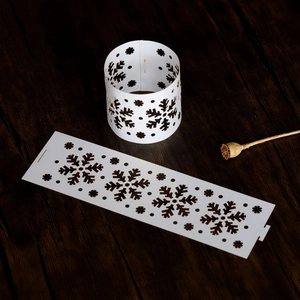 Macro view of white snowflake hollowed paper napkin rings on dark wood background