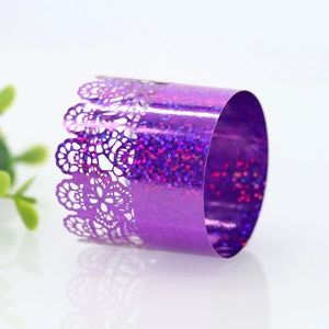 Macro detail of purple glitter laser-cut lace napkin ring with intricate hollow pattern