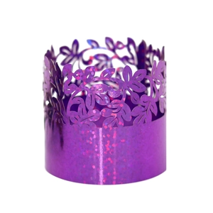Detail of purple laser-cut paper napkin rings with floral hollow design and glitter finish