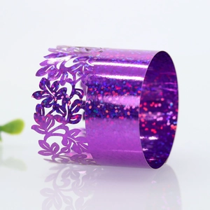 Detailed macro view of purple glitter floral napkin ring with laser cut pattern