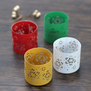 Macro view of pearlescent snowflake napkin rings in red, green, gold, and white