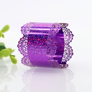Macro view of purple glitter lace napkin ring with laser-cut hollow pattern and shiny finish