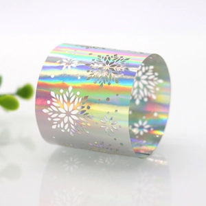 Close-up of laser-cut snowflake napkin ring with a rainbow holographic finish for parties