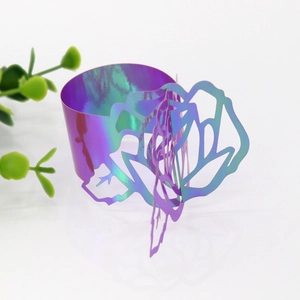 Detailed view of iridescent rose cutout napkin ring with purple and cyan gradient finish