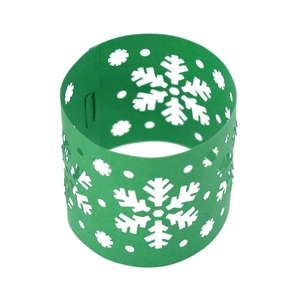 Detail of green laser-cut snowflake paper napkin ring for Christmas party table decor