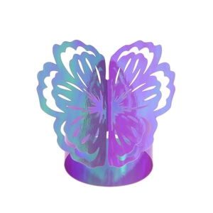 Detail of laser-cut iridescent butterfly napkin ring with hollow patterns and metallic shine