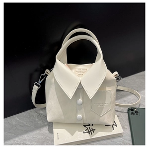 Detailed view of the creative shirt-style handbag with leather collar and button accents
