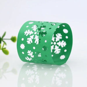 Detailed laser-cut green snowflake napkin ring with mirror finish for Christmas decor