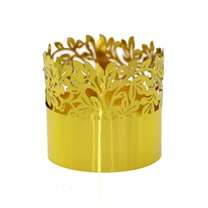 Detailed view of hollow gold napkin ring with leaf pattern for weddings and festive parties