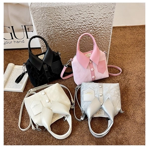Detailed close-up of textured PU leather bags in four colors with collar-shaped flap design