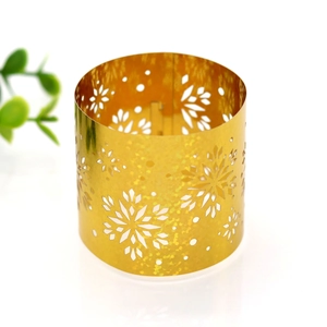 Macro shot of snowflake hollow design napkin rings with sparkling gold glitter finish