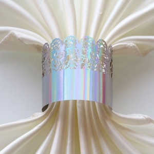Macro view of laser-cut hollow napkin ring with holographic silver mirror finish