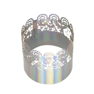 Detailed view of hollow lace napkin ring with vibrant holographic iridescent finish