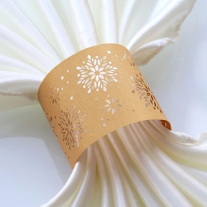 Elegant gold hollow snowflake napkin rings made of glitter paper for Christmas party decor