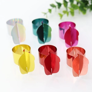 Close-up of six colorful metallic leaf napkin rings for Thanksgiving table decor