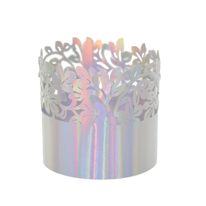 Detailed laser-cut cupcake wrapper with iridescent holographic pattern and floral lace design